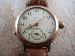 Very early Elgin rose gold wristwatch with decorative motifs, Manual, 35.5mm